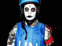 Costumed parade goers march during the 51st Annual Village Halloween Parade in New York, NY, on October 31, 2024. (