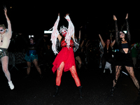 Costumed parade goers dance during the 51st Annual Village Halloween Parade in New York, NY, on October 31, 2024. (