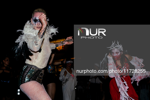 Costumed parade goers dance during the 51st Annual Village Halloween Parade in New York, NY, on October 31, 2024. 