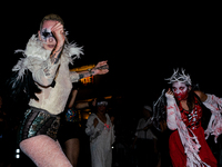 Costumed parade goers dance during the 51st Annual Village Halloween Parade in New York, NY, on October 31, 2024. (