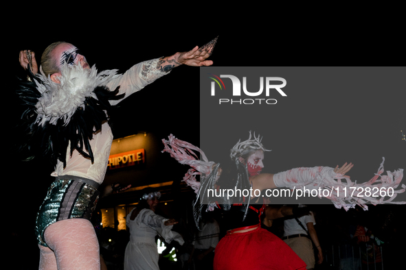 Costumed parade goers dance during the 51st Annual Village Halloween Parade in New York, NY, on October 31, 2024. 