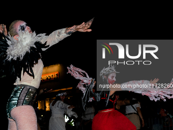 Costumed parade goers dance during the 51st Annual Village Halloween Parade in New York, NY, on October 31, 2024. (