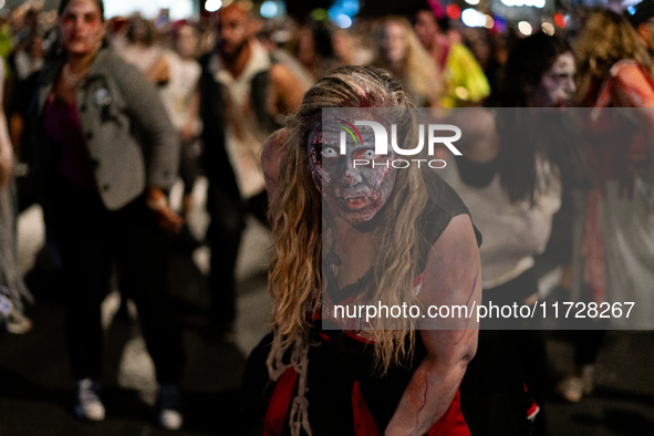 Costumed parade goers dance during the 51st Annual Village Halloween Parade in New York, NY, on October 31, 2024. 