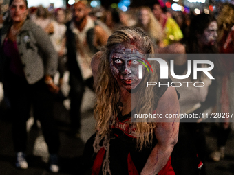 Costumed parade goers dance during the 51st Annual Village Halloween Parade in New York, NY, on October 31, 2024. (