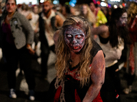 Costumed parade goers dance during the 51st Annual Village Halloween Parade in New York, NY, on October 31, 2024. (