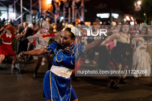 Costumed parade goers dance during the 51st Annual Village Halloween Parade in New York, NY, on October 31, 2024. 