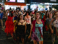 Costumed parade goers dance during the 51st Annual Village Halloween Parade in New York, NY, on October 31, 2024. (