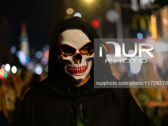 Costumed parade goers celebrate during the 51st Annual Village Halloween Parade in New York, NY, on October 31, 2024. (