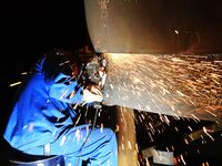 A construction worker builds petrochemical equipment parts at Lanshi Heavy Machinery Co., LTD., Hongshiya Street, in Qingdao, China, on Octo...