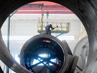 A construction worker builds petrochemical equipment parts at Lanshi Heavy Machinery Co., LTD., Hongshiya Street, in Qingdao, China, on Octo...