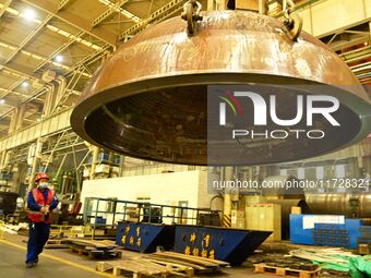 A construction worker builds petrochemical equipment parts at Lanshi Heavy Machinery Co., LTD., Hongshiya Street, in Qingdao, China, on Octo...