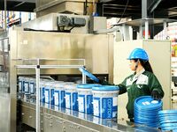 A worker produces lubricating oil on a production line at Qingdao Compton Technology Co LTD in Hongshiya Street, Qingdao, China, on October...