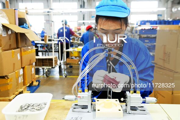 Workers increase product production at Qingdao Shanhai Household Products Co., LTD., Hongshiya Street, in Qingdao, China, on October 31, 202...