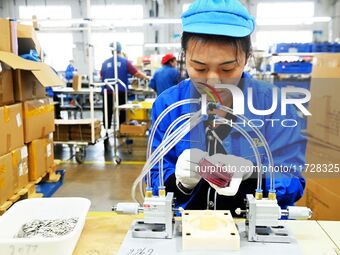 Workers increase product production at Qingdao Shanhai Household Products Co., LTD., Hongshiya Street, in Qingdao, China, on October 31, 202...