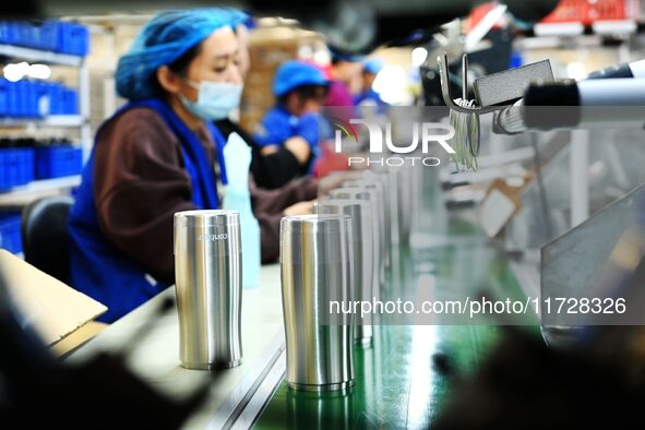 Workers increase product production at Qingdao Shanhai Household Products Co., LTD., Hongshiya Street, in Qingdao, China, on October 31, 202...