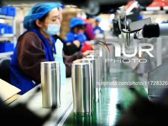 Workers increase product production at Qingdao Shanhai Household Products Co., LTD., Hongshiya Street, in Qingdao, China, on October 31, 202...