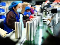 Workers increase product production at Qingdao Shanhai Household Products Co., LTD., Hongshiya Street, in Qingdao, China, on October 31, 202...