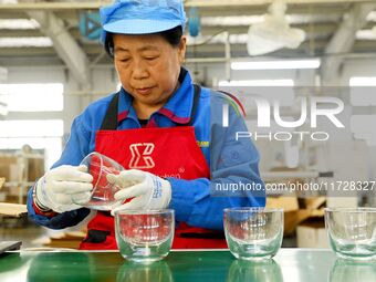 Workers increase product production at Qingdao Shanhai Household Products Co., LTD., Hongshiya Street, in Qingdao, China, on October 31, 202...