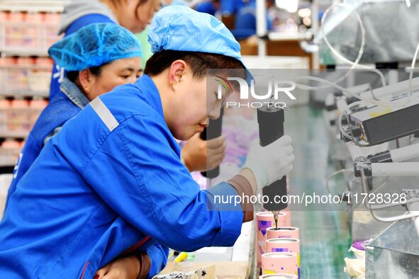 Workers increase product production at Qingdao Shanhai Household Products Co., LTD., Hongshiya Street, in Qingdao, China, on October 31, 202...