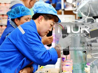 Workers increase product production at Qingdao Shanhai Household Products Co., LTD., Hongshiya Street, in Qingdao, China, on October 31, 202...