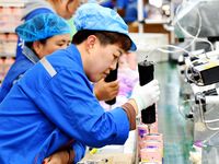 Workers increase product production at Qingdao Shanhai Household Products Co., LTD., Hongshiya Street, in Qingdao, China, on October 31, 202...