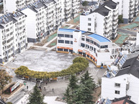 Workers renovate the Dongfeng Garden residential area in the Qingjiangpu district of Huai'an City, Jiangsu province, China, on November 1, 2...