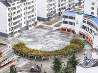 Workers renovate the Dongfeng Garden residential area in the Qingjiangpu district of Huai'an City, Jiangsu province, China, on November 1, 2...