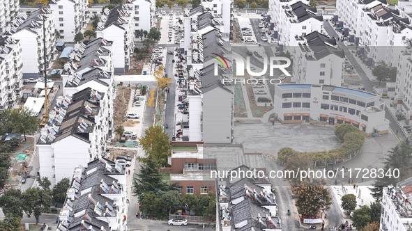 Workers renovate the Dongfeng Garden residential area in the Qingjiangpu district of Huai'an City, Jiangsu province, China, on November 1, 2...