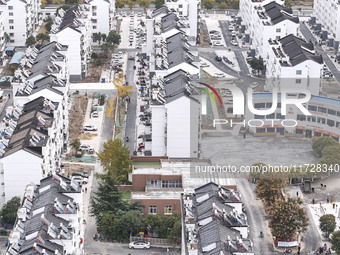 Workers renovate the Dongfeng Garden residential area in the Qingjiangpu district of Huai'an City, Jiangsu province, China, on November 1, 2...