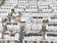 Workers renovate the Dongfeng Garden residential area in the Qingjiangpu district of Huai'an City, Jiangsu province, China, on November 1, 2...