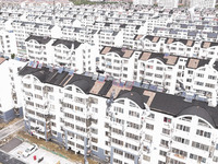 Workers renovate the Dongfeng Garden residential area in the Qingjiangpu district of Huai'an City, Jiangsu province, China, on November 1, 2...