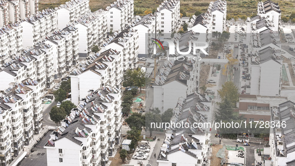 Workers renovate the Dongfeng Garden residential area in the Qingjiangpu district of Huai'an City, Jiangsu province, China, on November 1, 2...