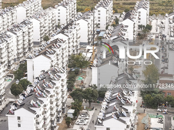 Workers renovate the Dongfeng Garden residential area in the Qingjiangpu district of Huai'an City, Jiangsu province, China, on November 1, 2...