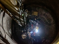 An employee works on a large pressure vessel customized by an oil refinery at the production workshop of Qingdao Lanshi Heavy Machinery Equi...