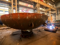 An employee works on a large pressure vessel customized by an oil refinery at the production workshop of Qingdao Lanshi Heavy Machinery Equi...