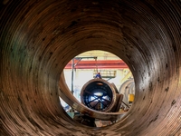 An employee works on a large pressure vessel customized by an oil refinery at the production workshop of Qingdao Lanshi Heavy Machinery Equi...