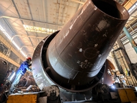 An employee works on a large pressure vessel customized by an oil refinery at the production workshop of Qingdao Lanshi Heavy Machinery Equi...