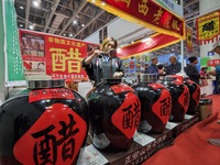 An exhibitor displays Shanxi aged vinegar at the 2024 Yantai International Food Industry Expo in Yantai, China, on November 1, 2024. (