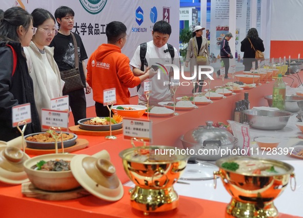 Visitors learn about prepared vegetable products at the 2024 Yantai International Food Industry Expo in Yantai, China, on November 1, 2024. 