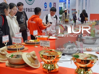 Visitors learn about prepared vegetable products at the 2024 Yantai International Food Industry Expo in Yantai, China, on November 1, 2024....