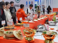 Visitors learn about prepared vegetable products at the 2024 Yantai International Food Industry Expo in Yantai, China, on November 1, 2024....