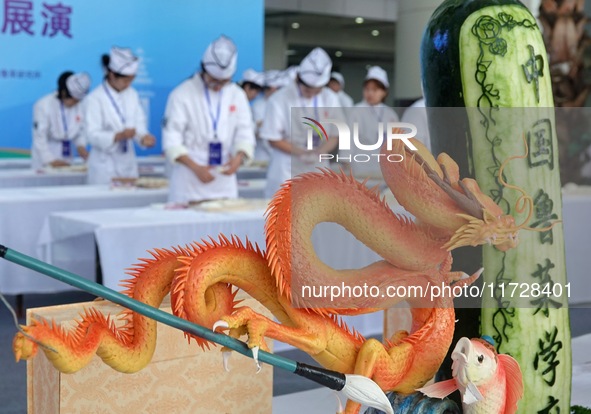 Students from Yantai Vocational College of Culture and Tourism perform during a cooking show at the 2024 Yantai International Food Industry...