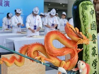 Students from Yantai Vocational College of Culture and Tourism perform during a cooking show at the 2024 Yantai International Food Industry...