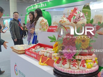 Visitors visit the 2024 Yantai International Food Industry Expo in Yantai, China, on November 1, 2024. (