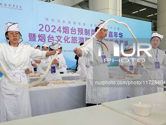 Students from Yantai Vocational College of Culture and Tourism perform during a cooking show at the 2024 Yantai International Food Industry...