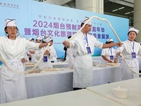 Students from Yantai Vocational College of Culture and Tourism perform during a cooking show at the 2024 Yantai International Food Industry...