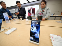 Customers shop for mobile phones at the Huawei store at Deji Square in Nanjing, China, on November 1, 2024. (