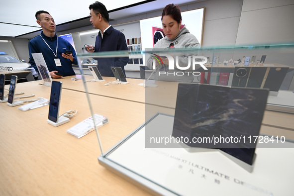 Customers shop for mobile phones at the Huawei store at Deji Square in Nanjing, China, on November 1, 2024. 