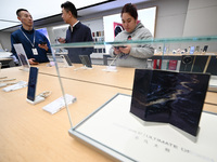 Customers shop for mobile phones at the Huawei store at Deji Square in Nanjing, China, on November 1, 2024. (