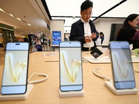 Customers shop for mobile phones at the Huawei store at Deji Square in Nanjing, China, on November 1, 2024. (